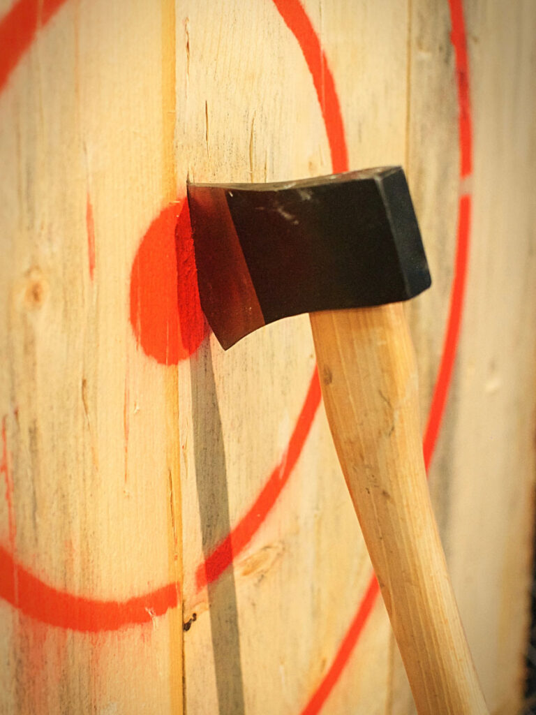 Throwing axes at Axes and Ice-cream is one of the best things to do on a rainy day in Destin.